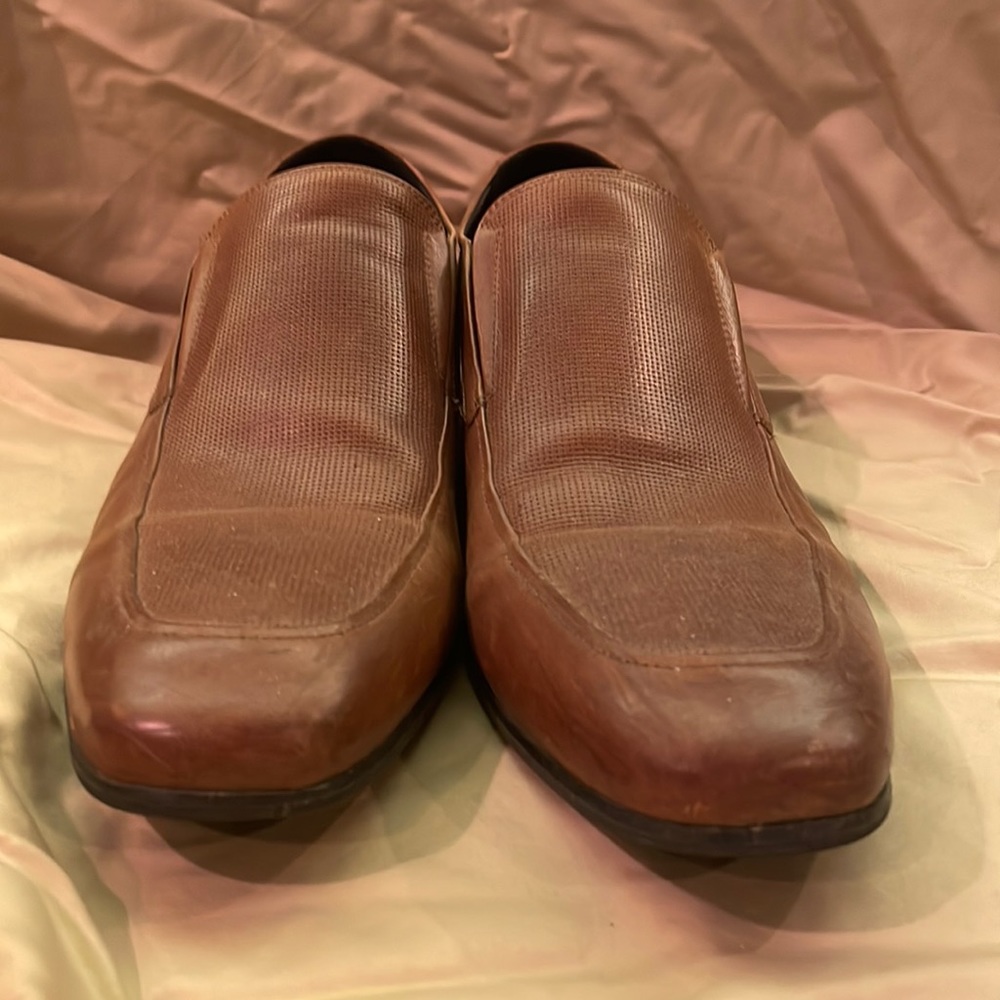 These are Kenneth Cole shoes in the color brown